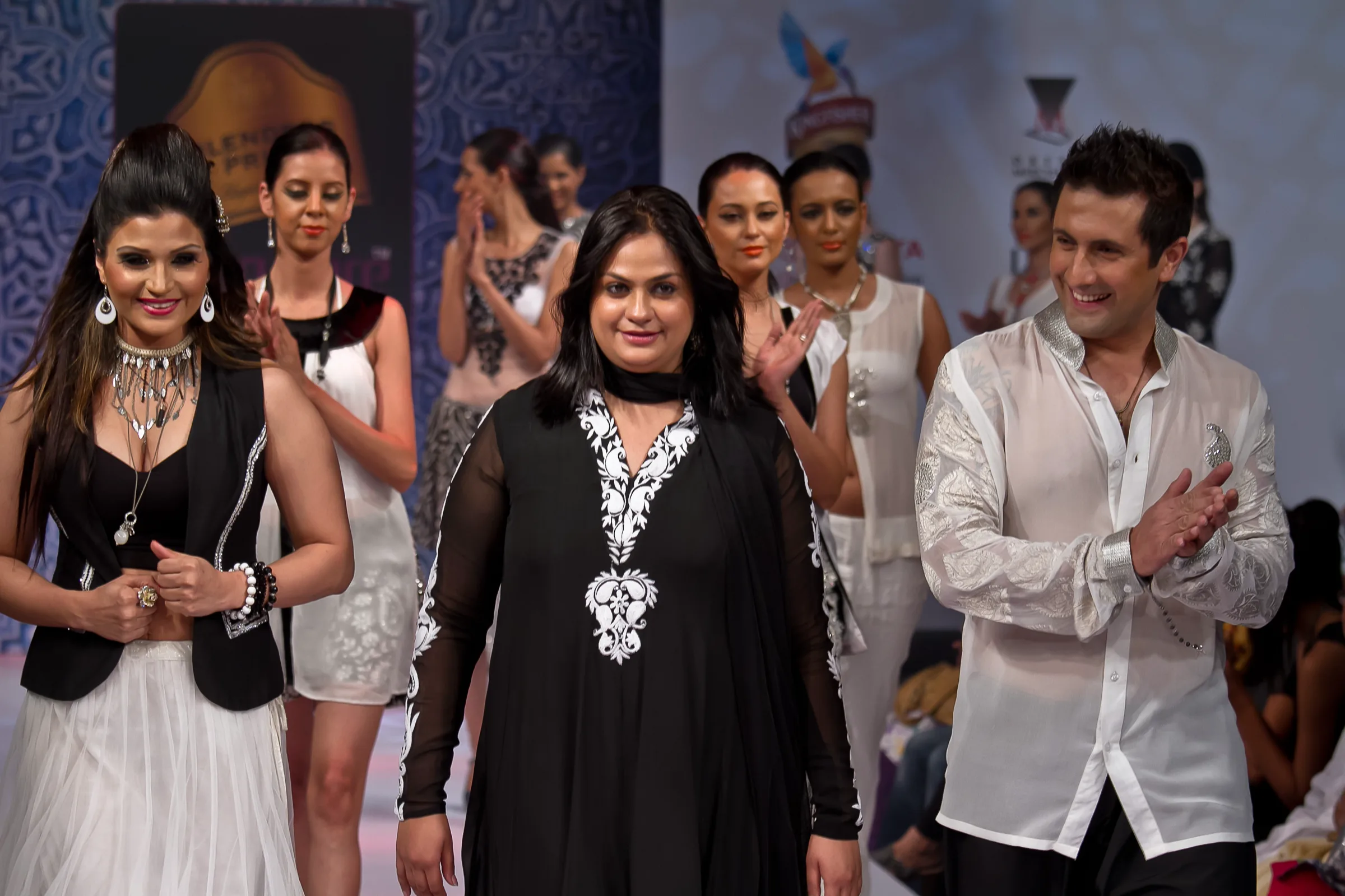Designers and models taking a bow on stage at the Bangalore Fashion Week finale, photographed by Vivek Pankaj
