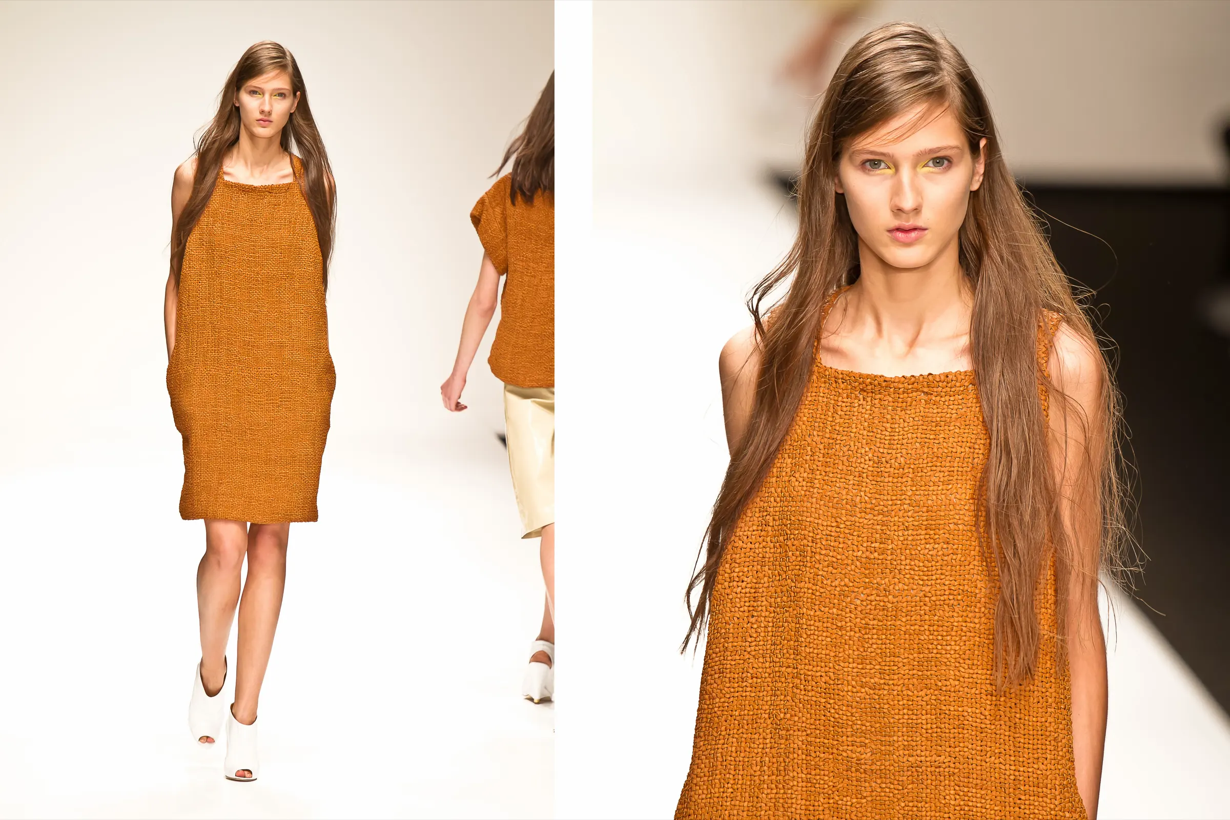 Model with long hair in an orange woven shift dress, full length and close up on a white runway, photographed by Vivek Pankaj