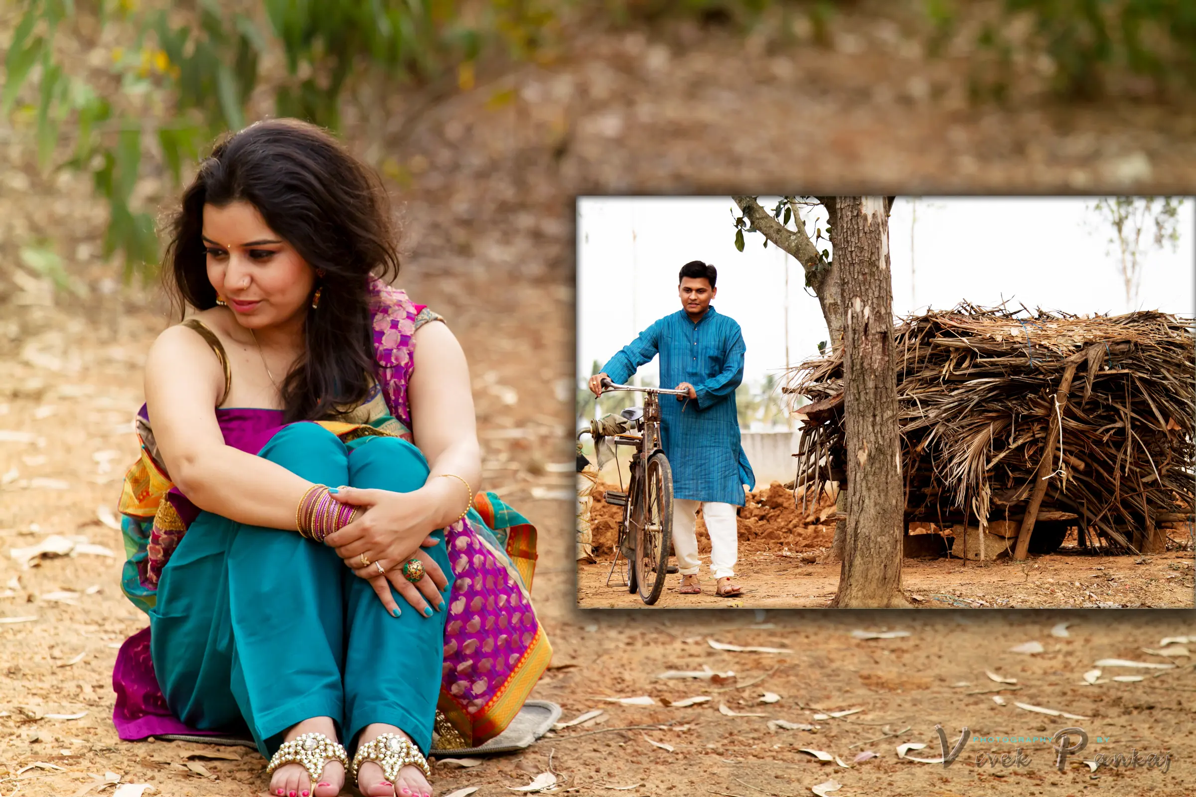 Woman seated on the ground in a teal outfit and her partner wheeling a bicycle past a woodpile, rural pre-wedding shoot by Vivek Pankaj